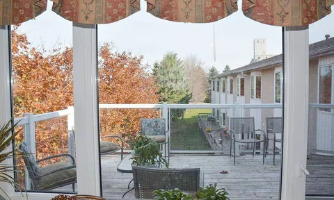 Courtyard seating viewed through tall windows