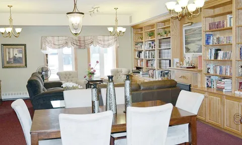 Library lounge with bookcases and dining table