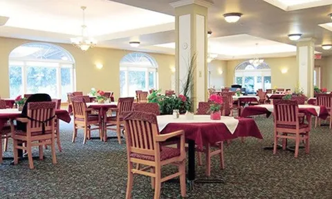 Dining room with red tablecloths and wide windows
