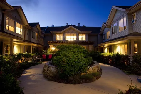 Residence and courtyard walkway illuminated at night