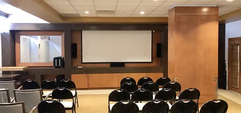 Rows of chairs facing a projection screen