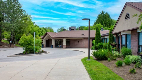 Low rise residence with landscaped entrance driveway