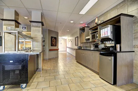 Communal kitchen with counters and cooking equipment.