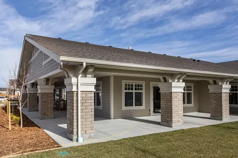 Single-storey building with a covered patio and stone columns