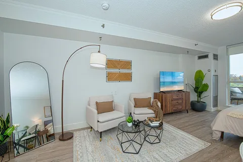 Suite sitting area with a sofa, armchairs and coffee table.