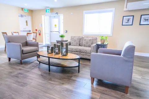 Lounge with sofas and a round coffee table.