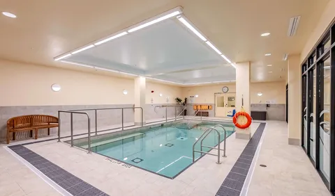 Indoor pool with handrails and a life ring