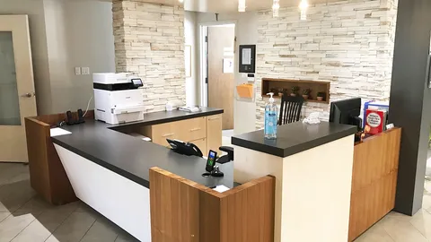Reception counter with a printer, telephone and hand sanitiser