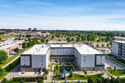 Aerial view of the residence surrounding a landscaped courtyard