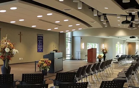 Village Centre hall with seating arranged for a gathering.