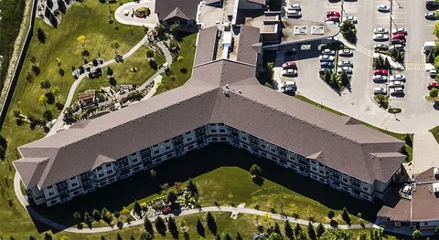 Aerial view of Concordia Village II, gardens and parking area.