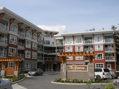 Residence exterior with balconies and a covered main entrance.