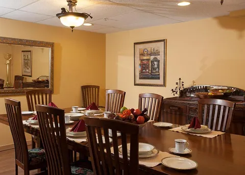 Private dining room with a wooden table and chairs.