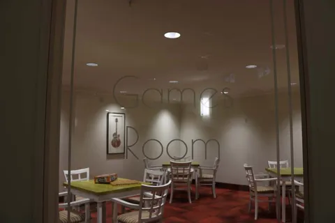 Games room with tables and chairs.
