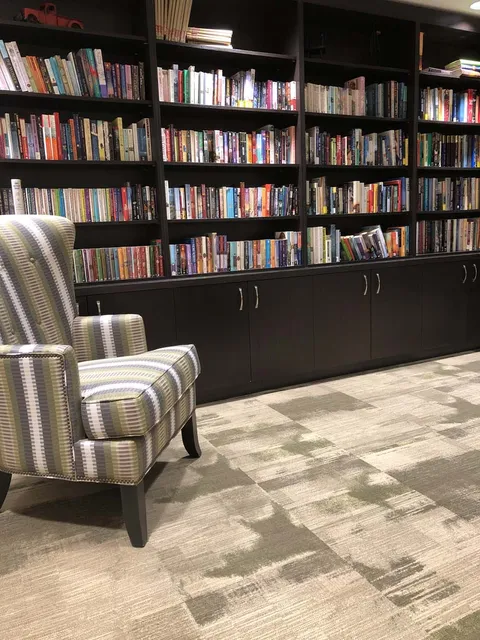 Library with bookshelves and seating.