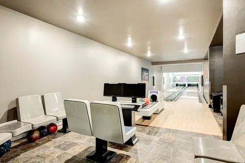 Bowling lanes with seating and score monitors