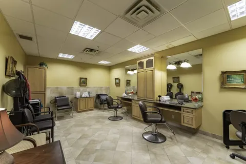 Hair salon with styling chairs, mirrors and wash basins