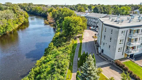 Aerial view of the residence beside the river.