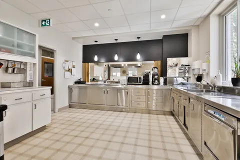 Kitchen with stainless steel counters, sinks and appliances