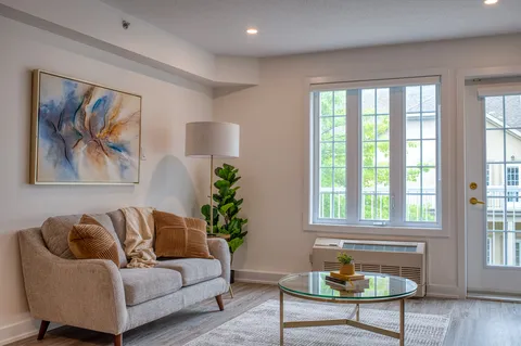 Suite living room with a sofa and glass patio doors
