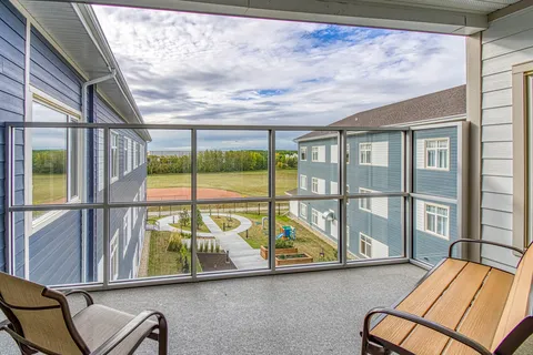 Covered balcony with seating overlooking the courtyard