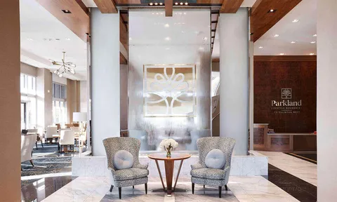 Lobby seating in front of a decorative water wall