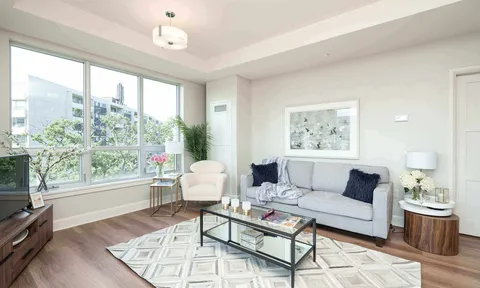 Suite living room with sofa and garden views