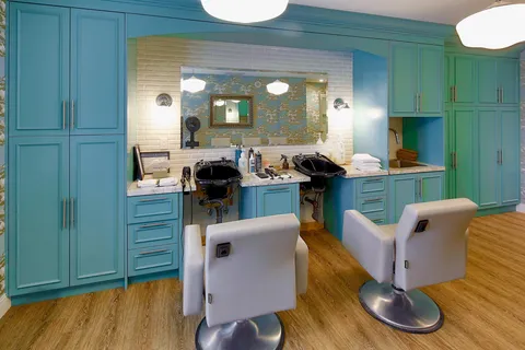 Salon with styling chairs, sinks and mirrors