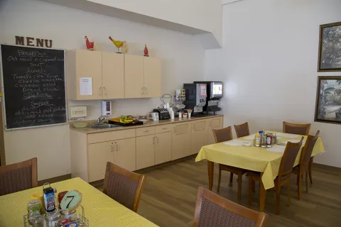 Dining area beside a beverage station and service counter.