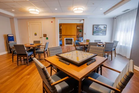 Room with tables, chairs and a Scrabble board
