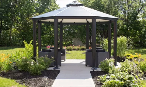 Garden gazebo surrounded by shrubs and trees.