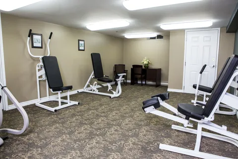 Fitness room with strength training machines.