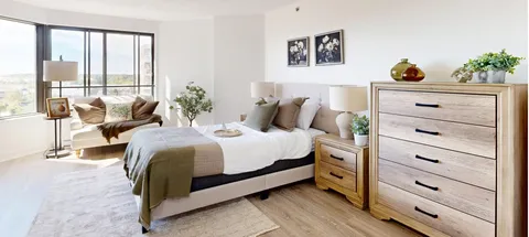 Bedroom with a bed, bedside tables and a window.