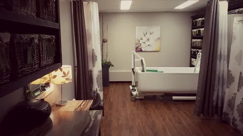 Bathroom with an assisted bathing tub, shelving and floral wall art