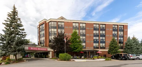 Front exterior with a covered drive-up entrance