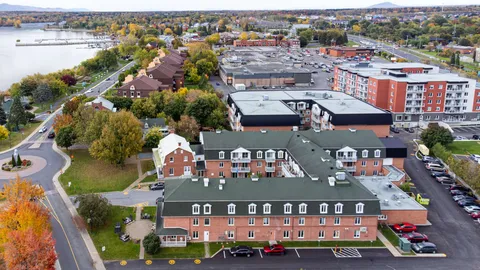Aerial view of the residence complex beside the river.