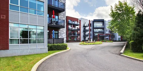Residence balconies beside the entrance driveway.