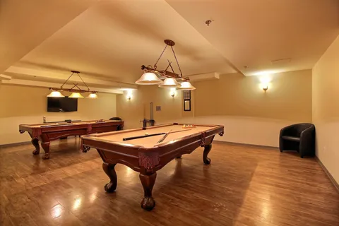 Billiards room with two pool tables.