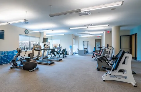 Exercise room with treadmills, bicycles and other fitness equipment