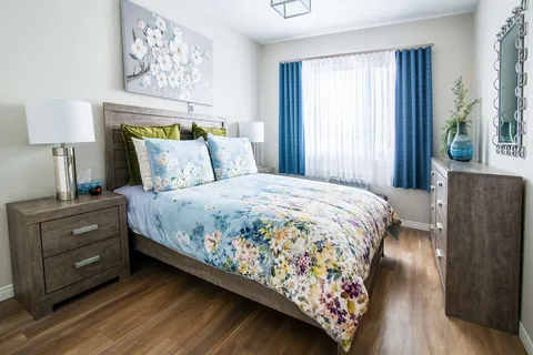 Bedroom with a double bed and floral bedding.