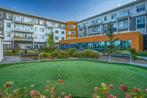 Residence wings surrounding a landscaped courtyard.