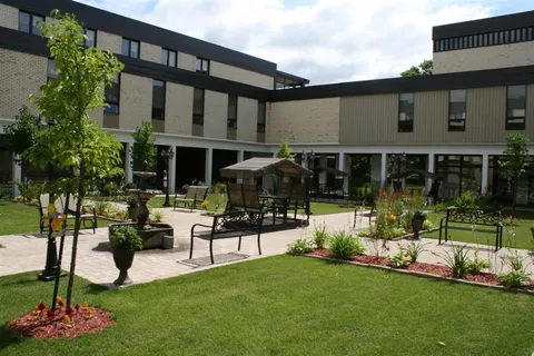 Courtyard with lawns, planters and covered bench swings