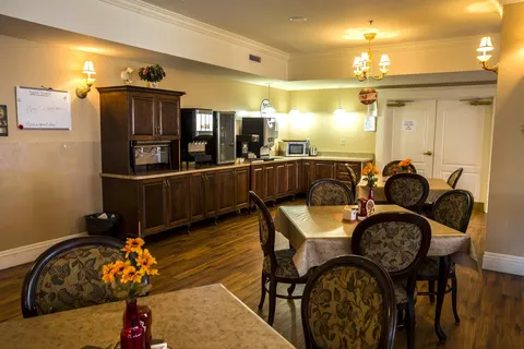 Bistro dining area with tables, upholstered chairs and serving counter.