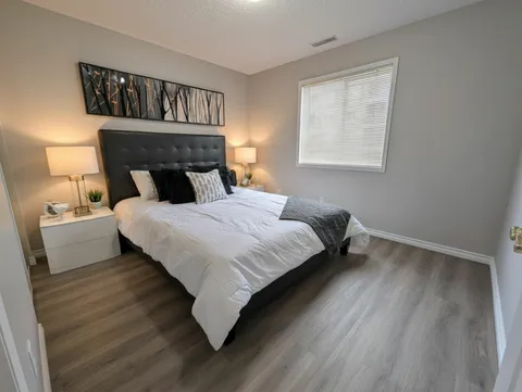 Bedroom with a double bed, bedside tables and a window