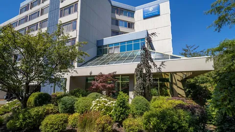 Residence facade with landscaped entrance beds.