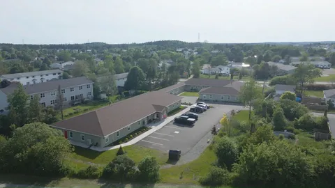 Aerial view of the single-storey residence and its landscaped grounds.