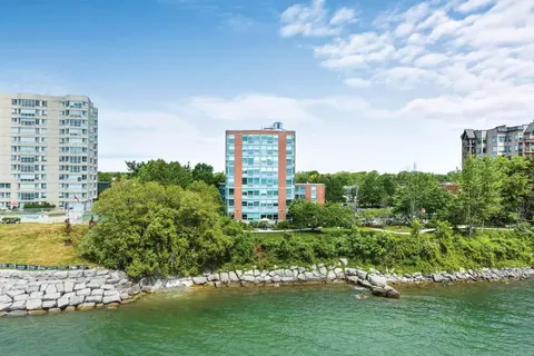 Residence overlooking water and a rocky shoreline