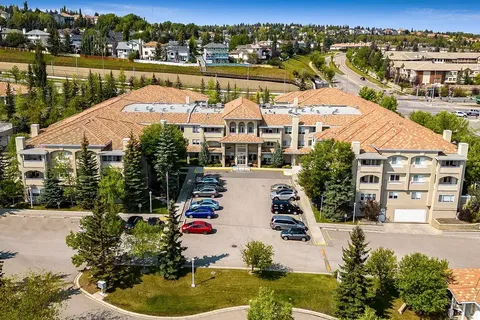 Aerial view of the three-storey residence, front entrance and parking area