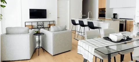 Sitting and dining area beside an open kitchen