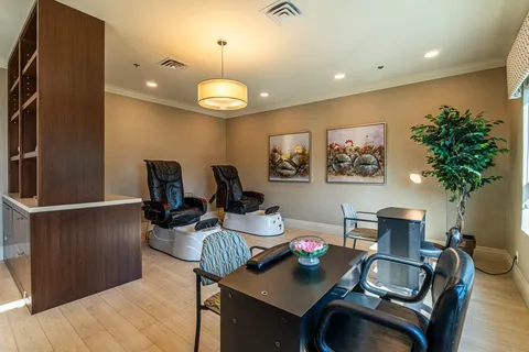 Salon with two pedicure chairs and manicure tables